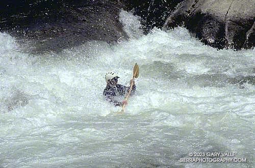 Kayaker just below the slide/ramp on Vortex Rapid on The Forks, North Fork Kern River.