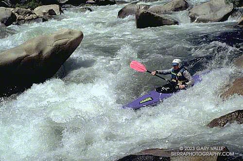 Charles Foster does the final drop from the left eddy at the bottom of Confusion rapid, Forks of the Kern.