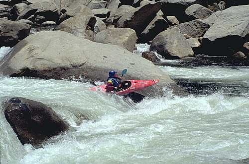 Winston Offil boofs into an eddy on river left on the second drop of Vortex Rapid, Forks of the Kern.