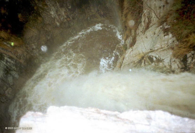 Looking down Switzer Falls to the plunge pool below. This approximately 50 ft. falls has a twisting 10-12 ft. drop leading to the main falls. The pool is shallow and confined. We didn't run it.