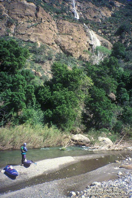 A side creek cascades hundreds of feet down tiered sandstone walls above Piru Creek.