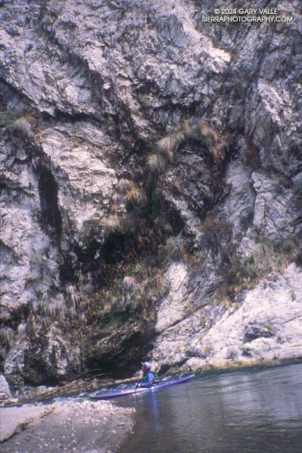 Towering rock walls border the stream at several points of this reach.